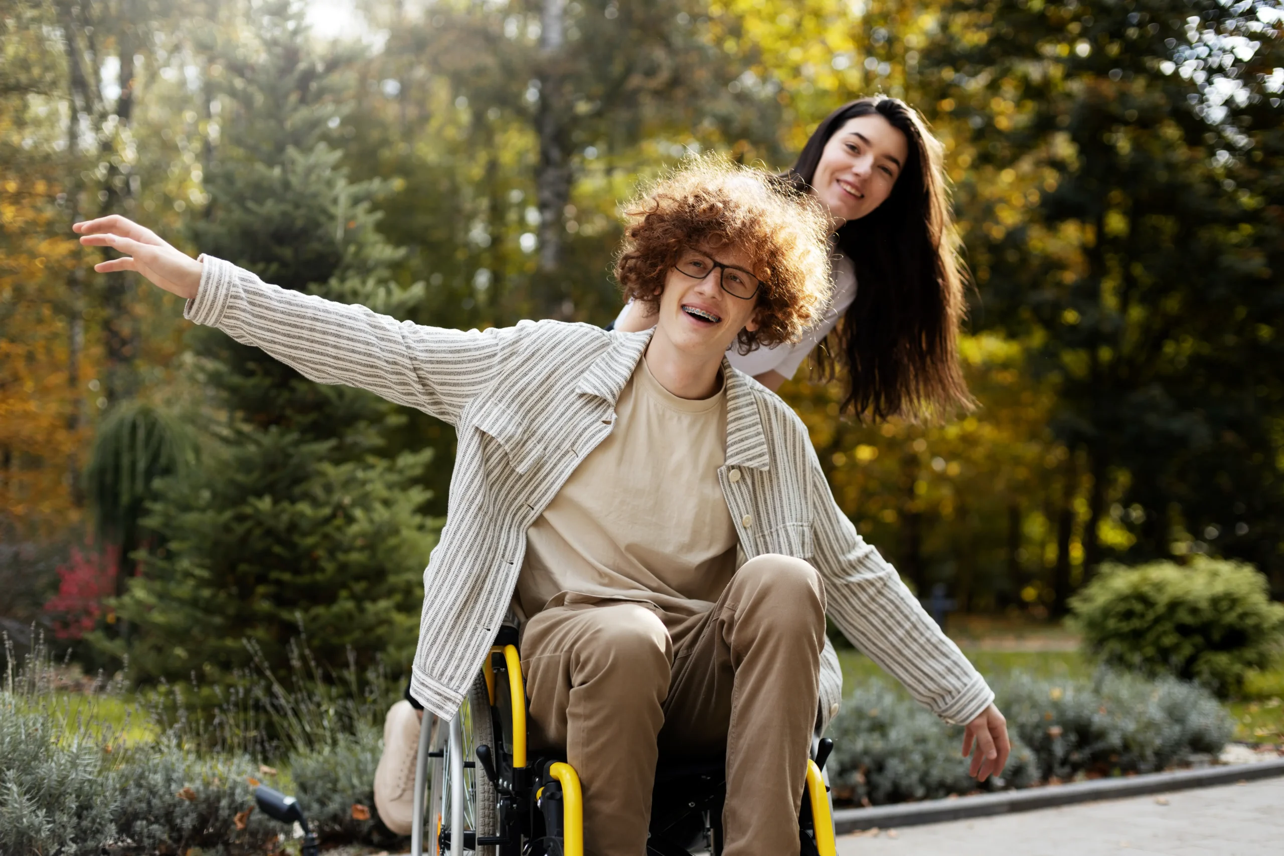 Smiling teens enjoying a walk in the park